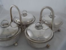 Two Regimental silver plated Vegetable Tureens. The covered, double tureens on stands, bearing the