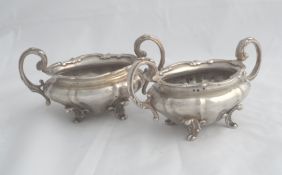 A pair of solid silver Regimental William IV style Sugar Bowls. The sugar bowls both with Regimental