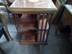A Mahogany Sheraton Style Revolving Bookcase. The bookcase having an inlaid top and chequered