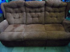 An Electric Reclining Three Piece Lounge Suite comprising a three seated sofa and two armchairs, the