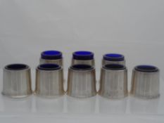 Eight silver plated Regimental Salts. The salts have the original blue glass liners and are