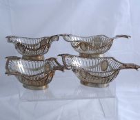 Four solid silver lattice work Bon Bon dishes. The dishes feature reeded edge, shell and foliate