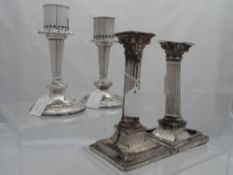 Pair of silver plated Candlesticks The candlesticks by Roberts and Belk together with a white