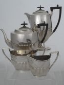 Solid silver Tea Set. A four piece solid silver tea set comprising of coffee pot, tea pot, twin