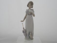 A Lladro Figure " Summer Stroll ". A collector`s piece, 1991, No. 7611.