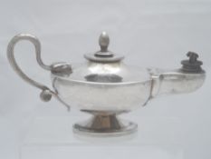 Solid silver Regimental Table Lighter. The lighter in the form of an oil lamp features a cobra