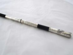 Silver mounted ebonised Regimental Swagger Stick. The swagger stick engraved with the names of