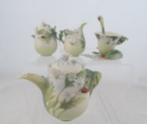 A Franz Collection tea set comprising tea pot, milk jug, sugar bowl, cup saucer and spoon in the