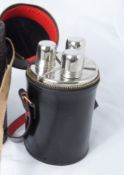 A Leather Container with drinking flasks.