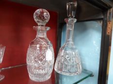 Two Waterford Crystal Decanters, approx. 32 cms and 27 cms.