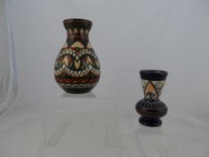 A French Quimper ovoid vase with brown cream and ochre design, approx. 22 cms, signed Quimper to