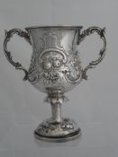 Solid silver Regimental Presentation Cup. The twin handled ornate cup features a floral design and