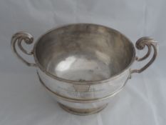 Solid silver Regimental Wine Cooler. The twin handled wine cooler on pedestal base, inscribed ‘