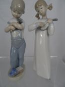 Lladro Figure, a girl playing the violin together with a boy with his toys (2)