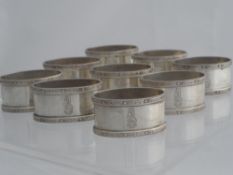 A set of nine solid silver Regimental Presentation Napkin Rings. The napkin rings of Celtic knot