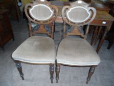 A Pair of Edwardian Side Chairs. The chairs being decorated with inlay and having velvet covered