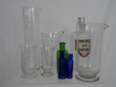 A Misc. Collection of Apothecary Bottles incl. pouring jugs etc. (9)