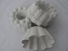 Shelley Moulds. Three glazed jelly moulds, two turret shaped & one circular, each with printed mark.