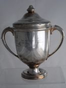 Solid silver Regimental Trophy. The twin handled trophy inscribed ‘The Homing Pigeon Club