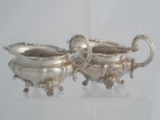 A pair of solid silver Regimental William IV style Sauce Boats. The sauce boats stamped Silver G &