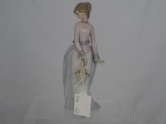 A Lladro Figure " Innocence In Bloom ". A 1996 collector`s piece, No. 07644