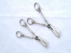 Two solid silver Regimental Grape Scissors. The grape scissors inscribed 1st Battalion Duke of