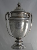 Solid silver Regimental Sporting trophy. The twin handled trophy of classical design features an