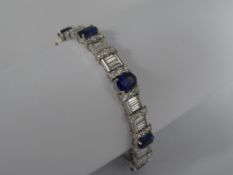 Platinum Sapphire and Diamond Bracelet, featuring eight oval shaped faceted sapphires interspaced