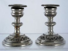 Solid silver Candlesticks. Pair of 20th century silver candlesticks with scroll design to base and