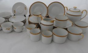 A Limoges Porcelain Tea and Coffee Set by Georges Boyer. The set comprising twelve tea cups and