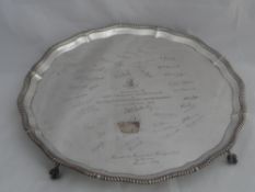 Solid silver Regimental Salver. The salver features a scalloped and beaded edge on ball and claw