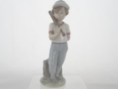 A Lladro Figure " Baseball Player ". 1985 No. 7610, This is a special signed by a Lladro family