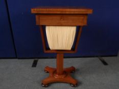 A Victorian Rosewood Games Table / Sewing Box. The table being on a single column with a drawer to