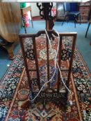 An Oriental Rosewood Lamp Stand scroll decoration to the supporting frame.