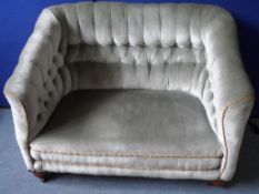 A Vintage Button Back Two Seated Sofa. The sofa being covered in a green velvet fabric, approx.