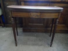 A Mahogany Regency Open Leaf Table. The table having reeded legs and panelled inlay to the front.