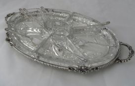 Harrods of London Solid silver and Cut Glass Hors d’ oeuvre Tray. The solid silver twin handled hors