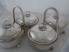 Two silver plated Vegetable Tureens. The covered, double tureens on stands. Unmarked.