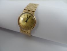 Bueche Girod Watch, A vintage 9 ct hallmarked yellow gold ladies wrist watch with gold face on 9