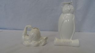 A COALPORT BLANC DE CHINE PORCELAIN WISE OLD OWL WEARING A MORTAR BOARD, GLASSES AND SITTING ON A