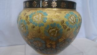 A ROYAL DOULTON `SLATER PATENT` PLANTER WITH AQUAMARINE FLORAL DESIGN ON A PALE YELLOW GROUND,