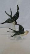 A PAIR OF PORCELAIN SWALLOWS ON THE WING BY KARL ENS, GERMANY, DECORATED IN SUBDUED POLYCHROME ON