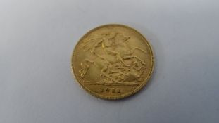 A GEORGE V 1911 HALF GOLD SOVEREIGN (GOOD CONDITION) B.P BENEATH THE DRAGON B.M BENEATH THE NECK.