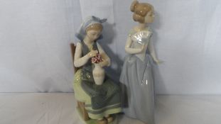 A LLADRO FIGURE OF A DAISA TOGETHER WITH A NAO FIGURE OF A DANCING GIRL. (2)