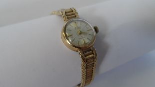 A LADY`S BENTIMA 9ct GOLD WRISTWATCH ON 9 CT GOLD FANCY LINK BRACELET WITH SAFETY CHAIN. WEIGHT