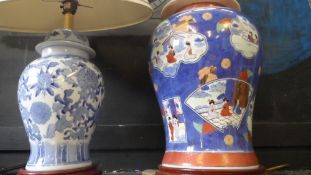 TWO CONTEMPORY ORIENTAL LAMP BASES, THE FIRST WITH COBALT BLUE AND APRICOT DECORATION DEPICTING