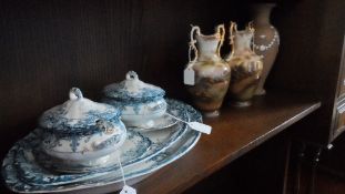 TWO VICTORIAN VASES DEPICTING A CASTLE AND AN ABBEY RUIN, WITH GILDED HANDLES. 25 cms, ROYAL DOULTON