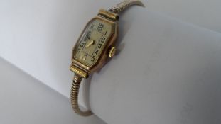 A LADY`S VINTAGE 9ct YELLOW GOLD RECTANGULAR WATCH, THE CASE STAMPED H. I.C MODEL NR 119941.