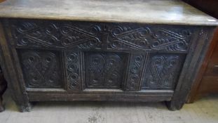 A CARVED PANELLED CHEST, THE 17th CENTURY CARCASS HAVING A LATER LID, APPROX. 119 X 57 X 67 cms