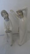 TWO LLADRO `SLEEPY HEAD FIGURES` OF A BOY AND GIRL IMPRESSED MARKS TO BASE 21 cms.